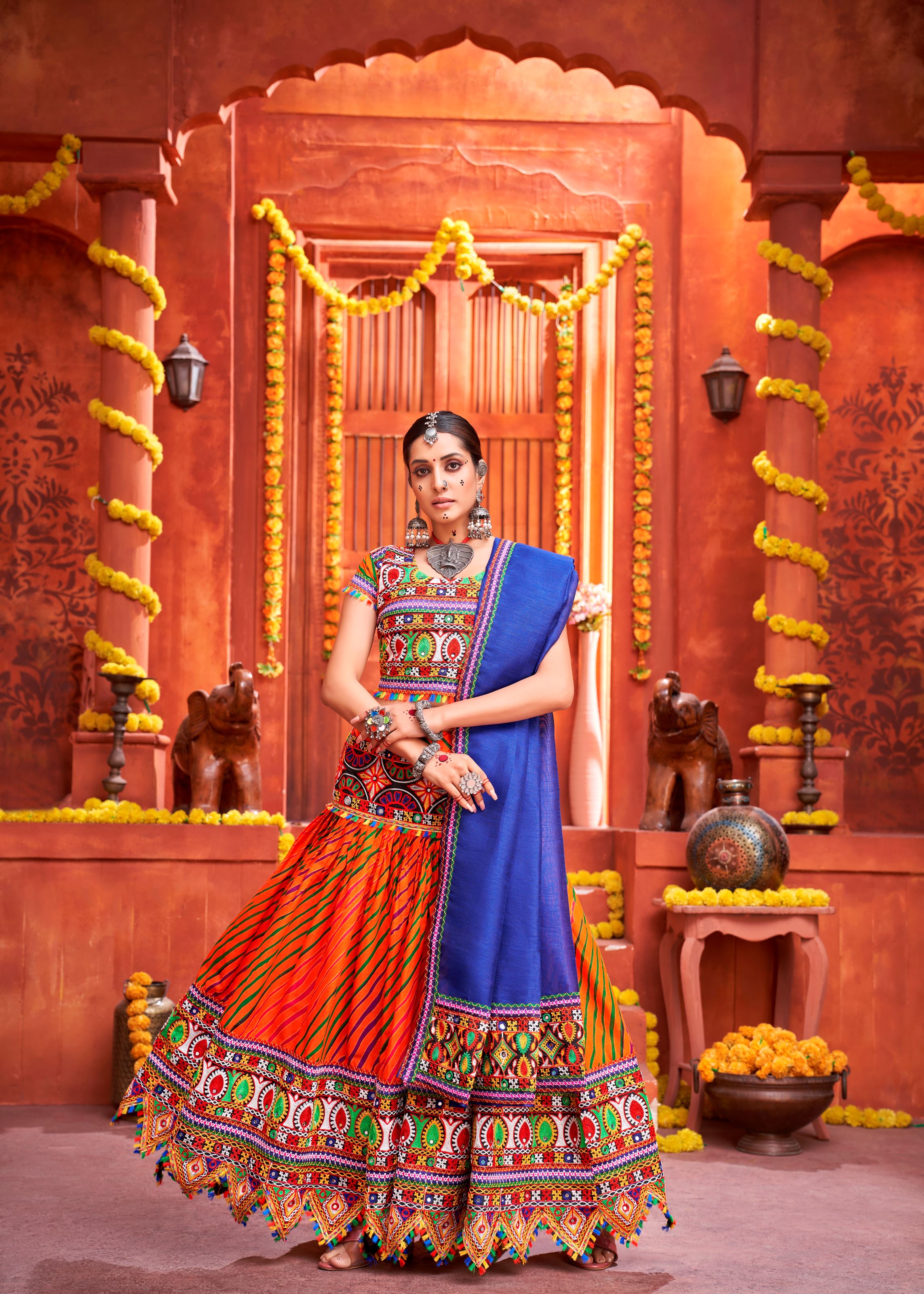 Orange And Royal Blue Navratri Chaniya Choli With Laheriya Print With Gamthi Work And Real Mirror Work
