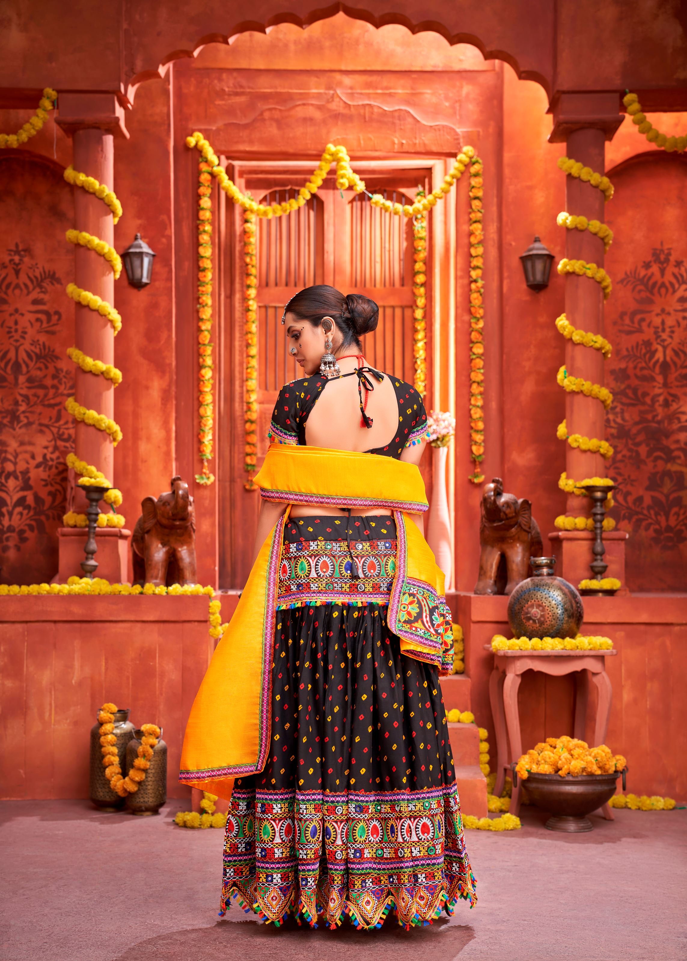 Black And Yellow Navratri Chaniya Choli With Bandhani Print With Gamthi Work And Real Mirror Work