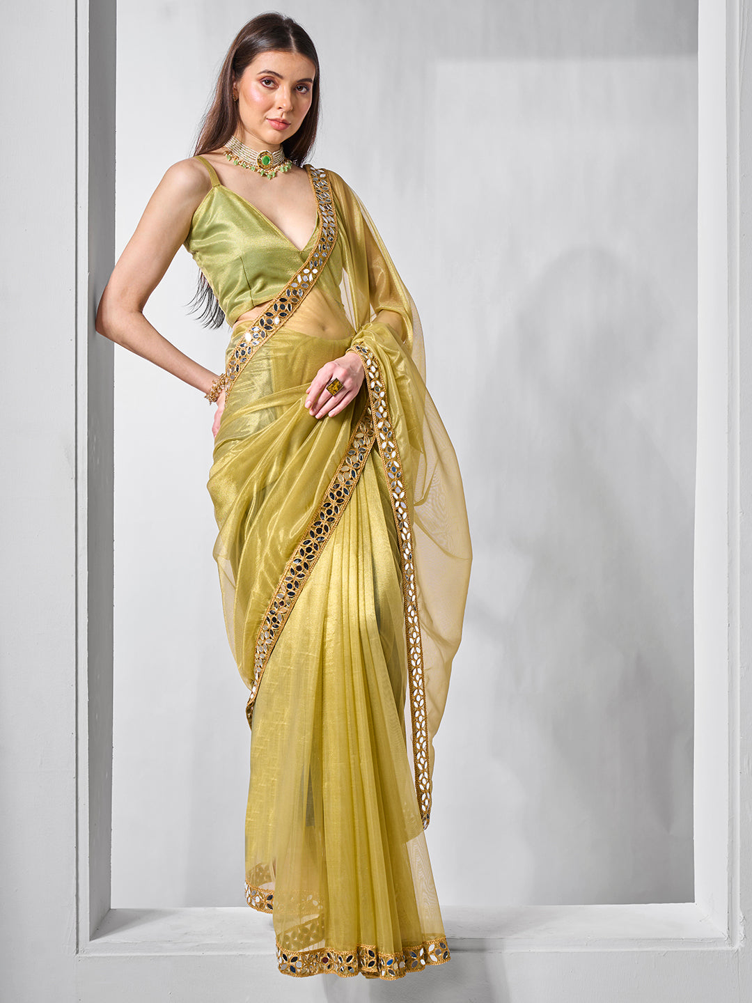 Green Gold Tissue Net Solid Texture Saree With Graceful Gold Cotted