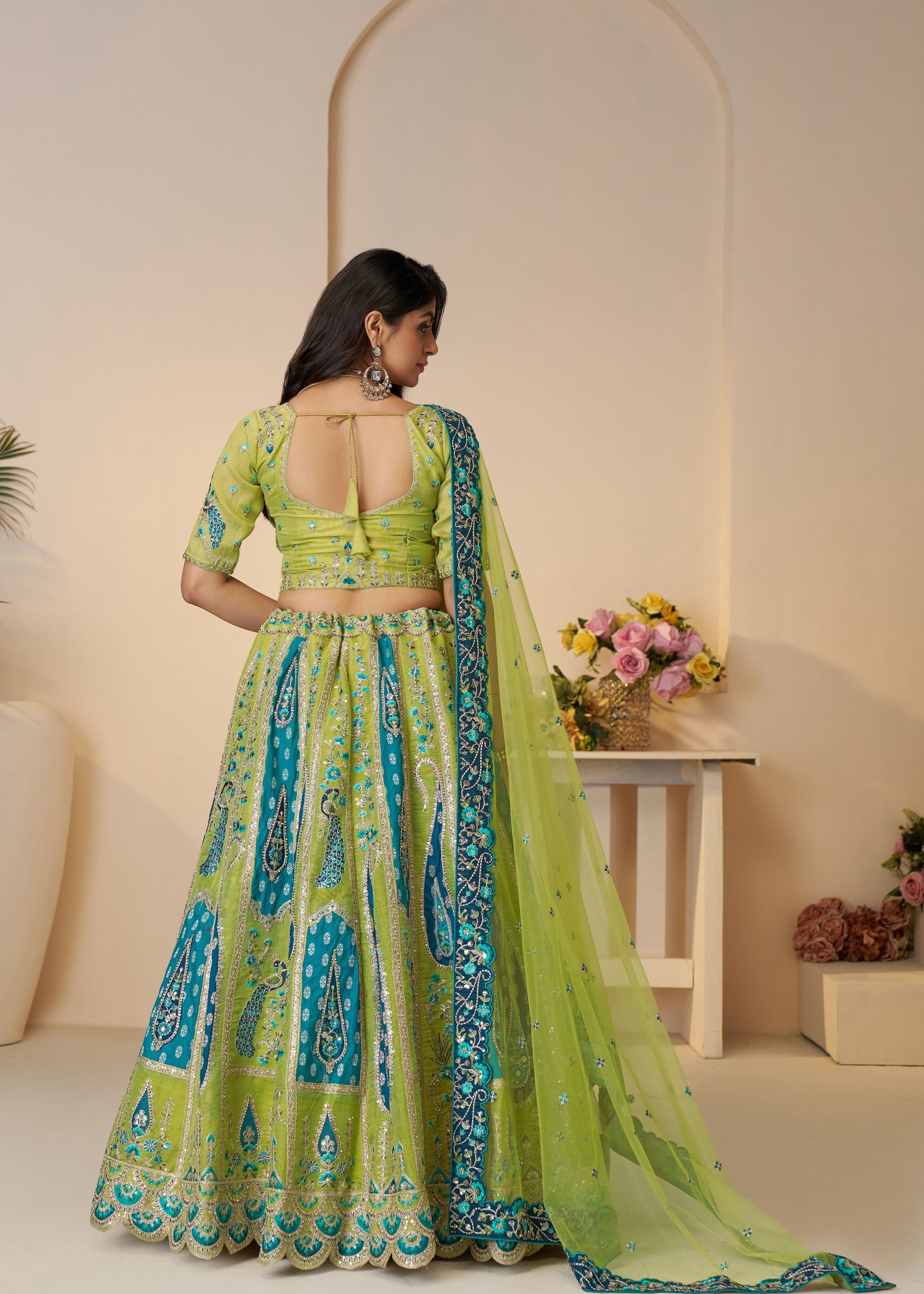 Royal Grandeur Bridal Green Soft Net Lehenga With Paisley And Peacock Motifs
