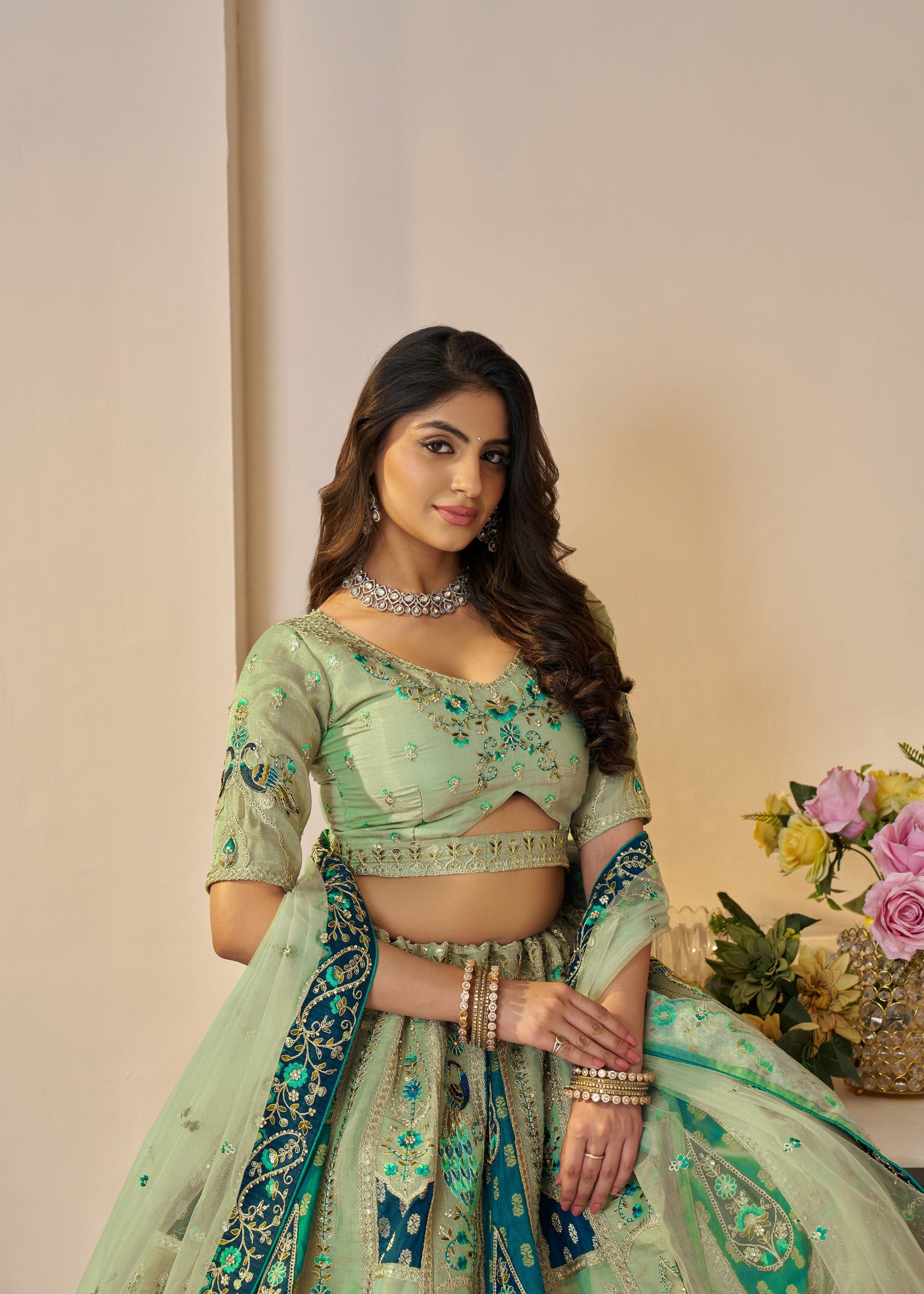 The Rajsi Haathi Collection: Graceful Green With Peacock Embroidered Bridal Lehenga