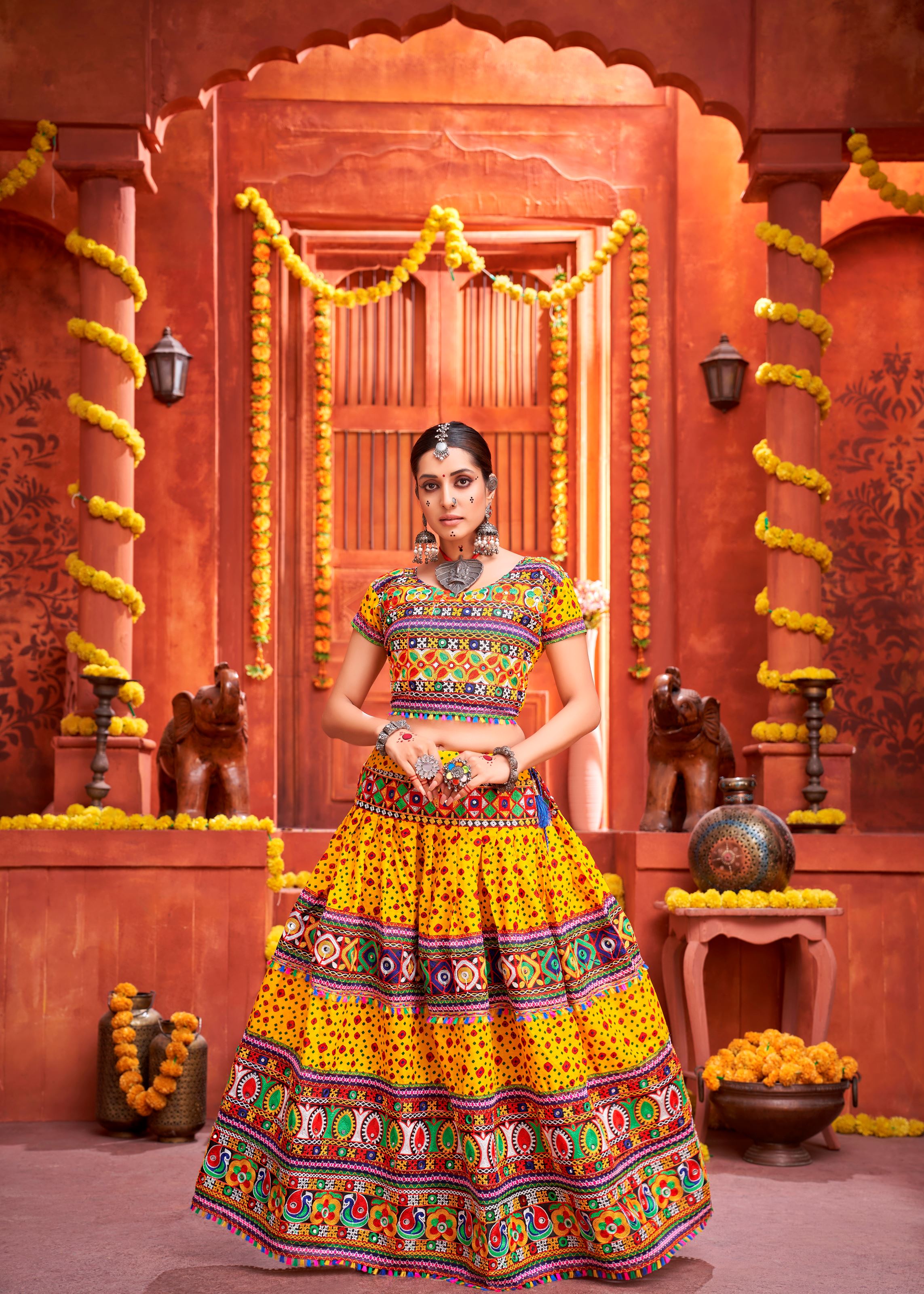Yellow And Black Navratri Chaniya Choli With Patola Print And Gamthi Work And Real Mirror  Work