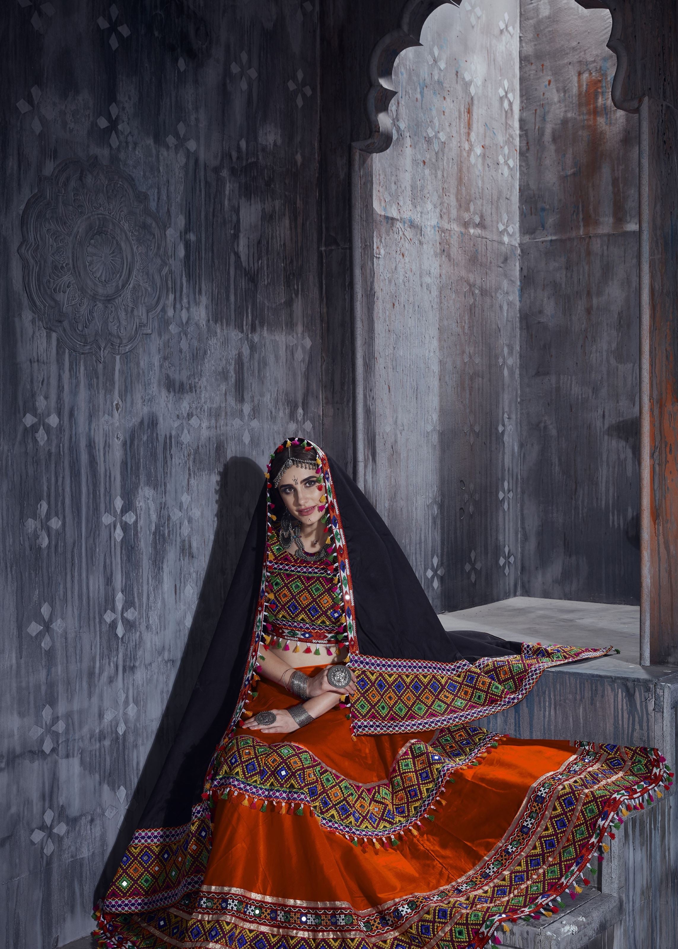 Orange And Black Navratri Chaniya Choli With Gamthi Lace Work With Mirror Work