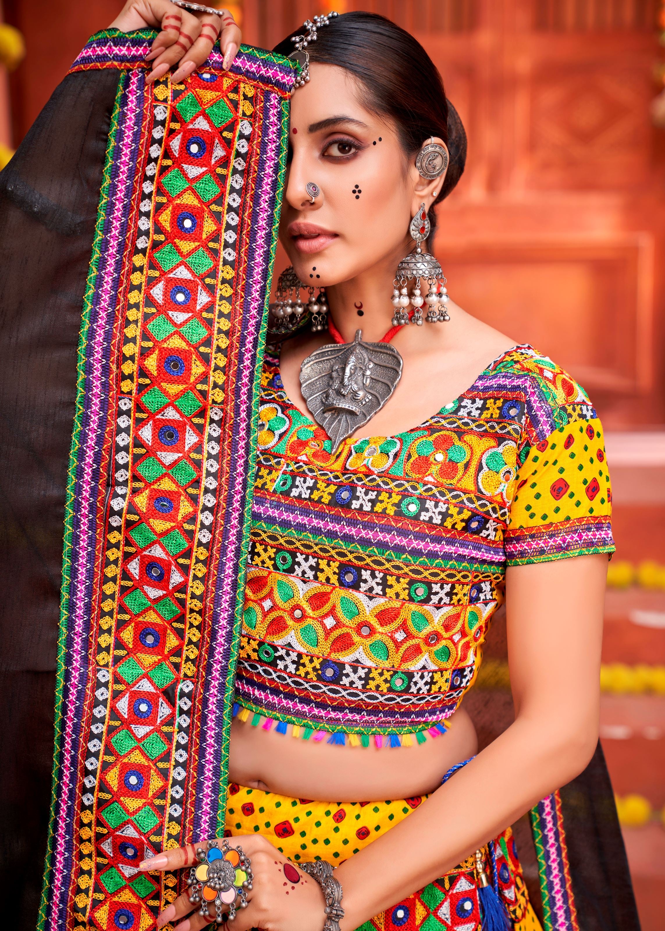 Yellow And Black Navratri Chaniya Choli With Patola Print And Gamthi Work And Real Mirror  Work