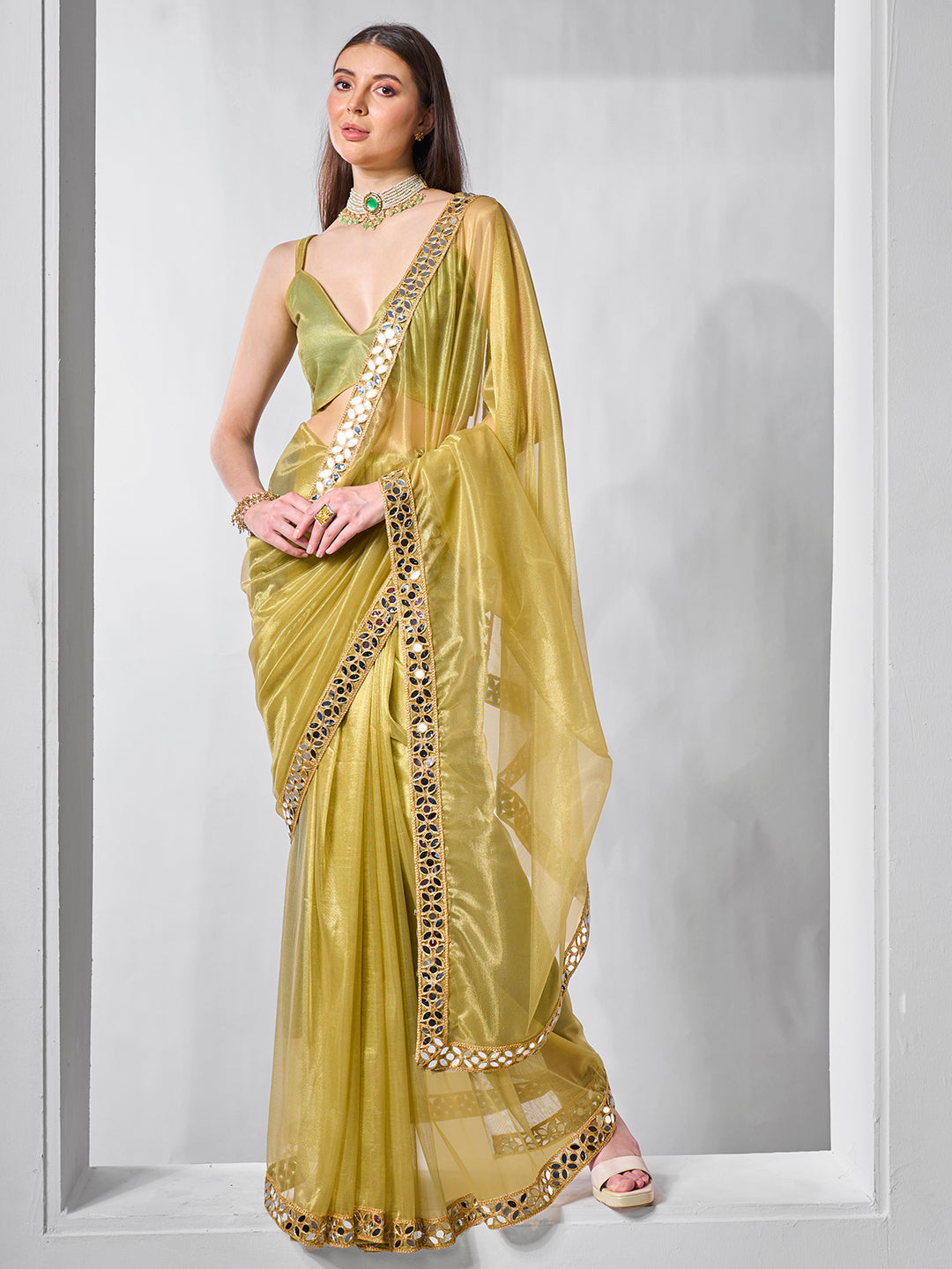 Green Gold Tissue Net Solid Texture Saree With Graceful Gold Cotted