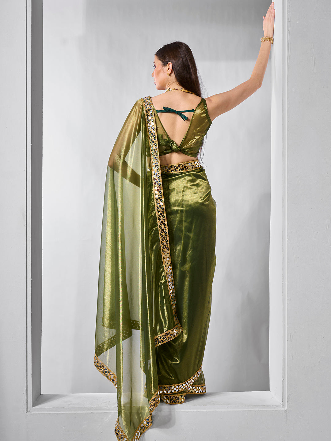 Green Gold Tissue Net Solid Texture Saree With Graceful Gold Cotted