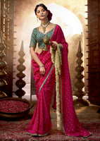 Rani Pink Viscose Crepe Saree with Butti Weaving and Embroidered Blouse