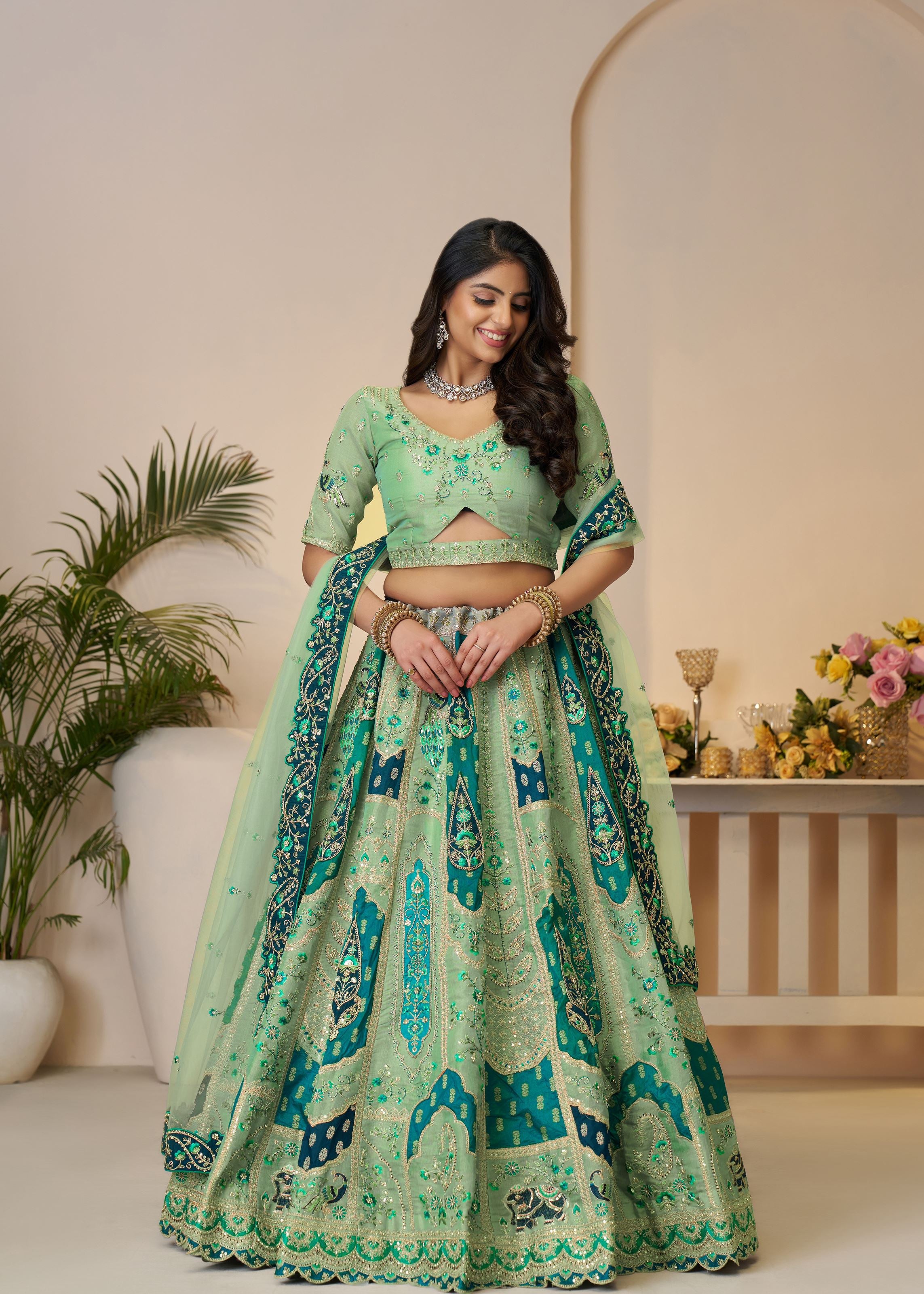 The Rajsi Haathi Collection: Graceful Green With  Peacock Embroidered Bridal Lehenga