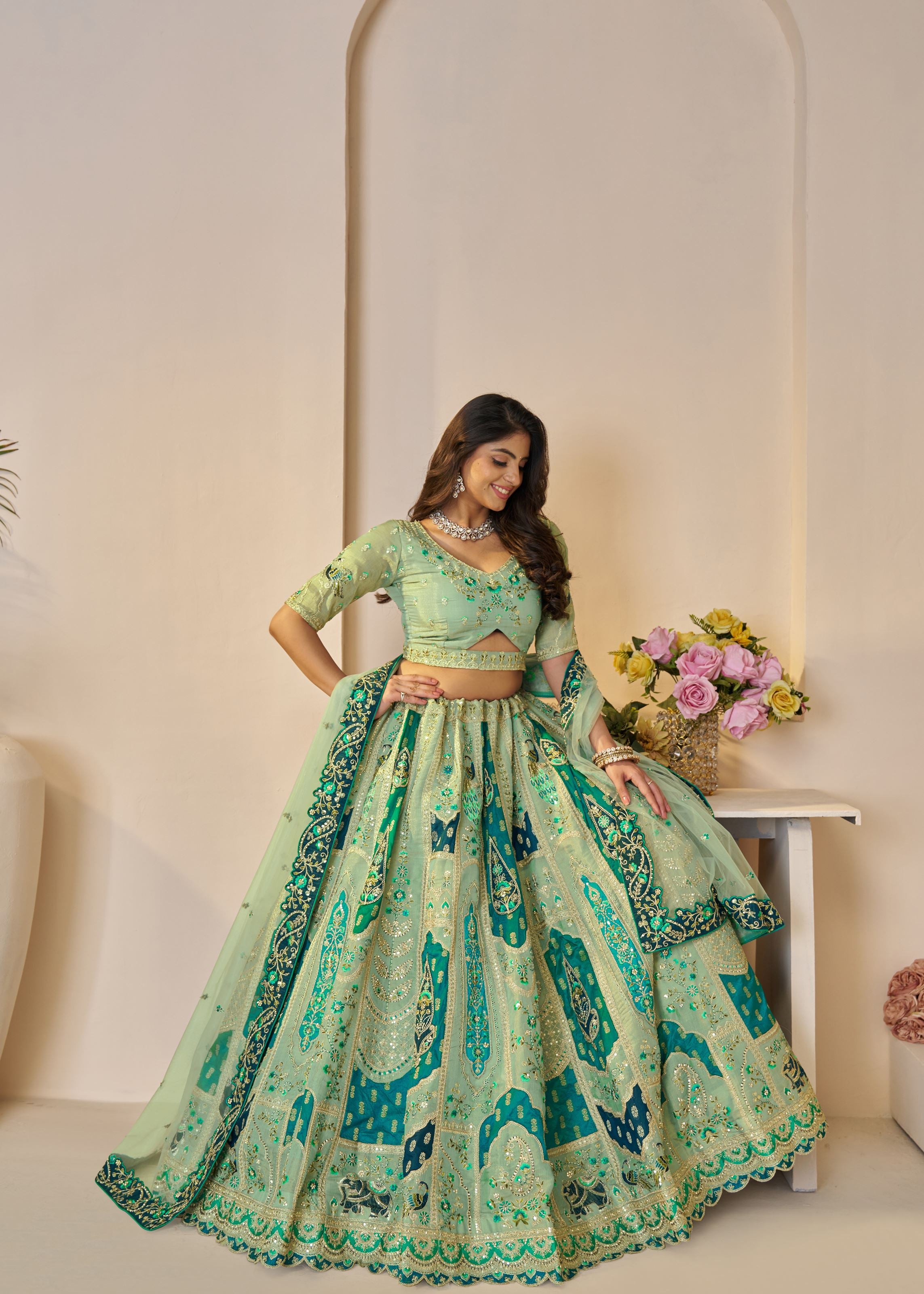 The Rajsi Haathi Collection: Graceful Green With  Peacock Embroidered Bridal Lehenga
