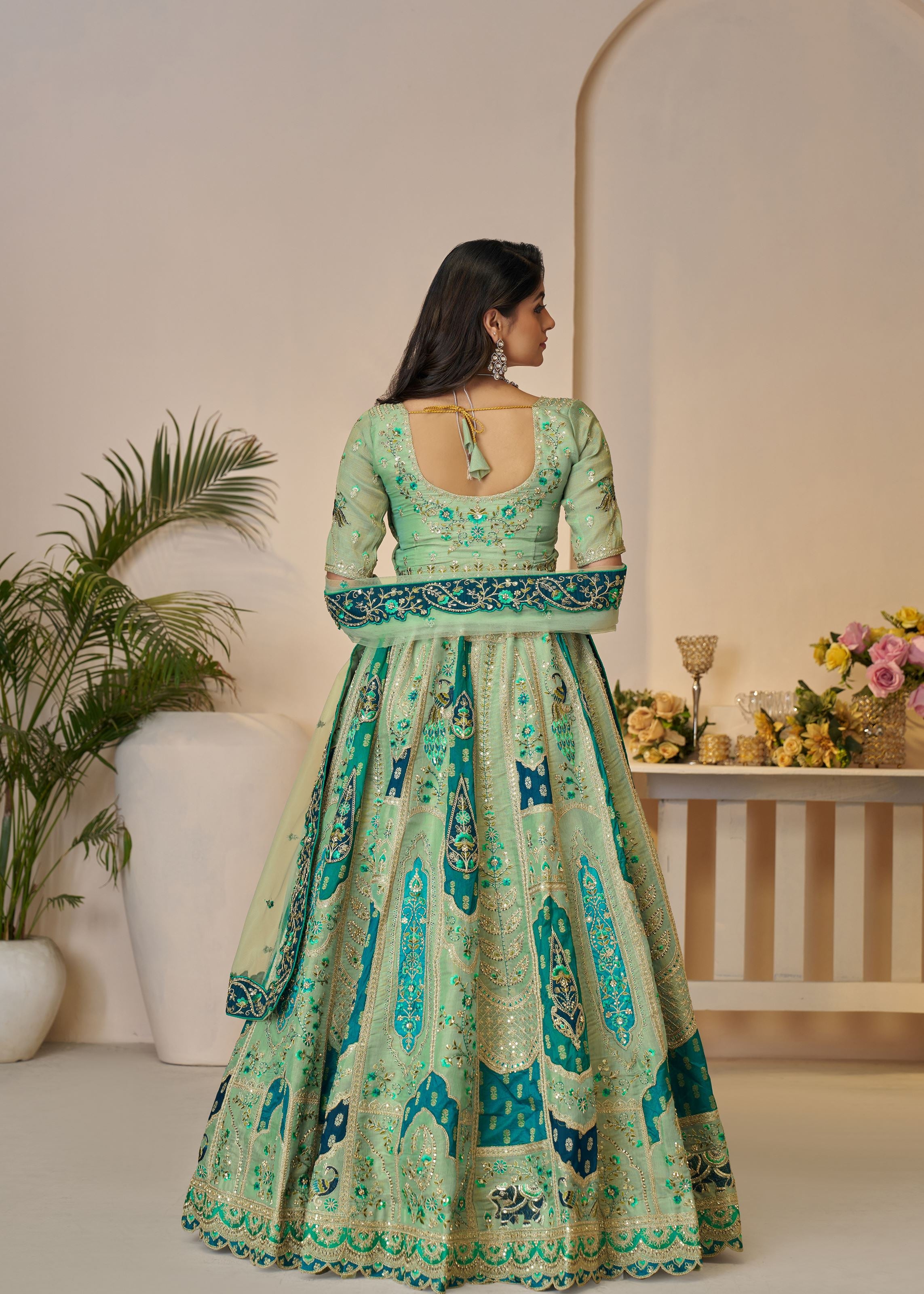 The Rajsi Haathi Collection: Graceful Green With  Peacock Embroidered Bridal Lehenga